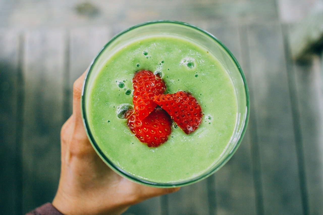 Green Smoothie with Strawberries on top